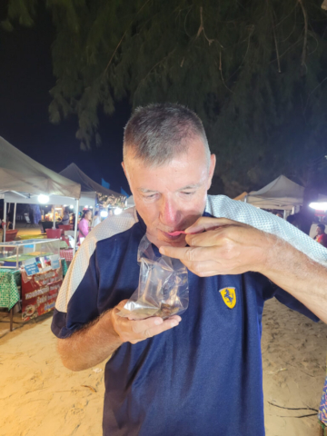 Geoff (Ben) eating Silkworms at hte Lng Lay night market