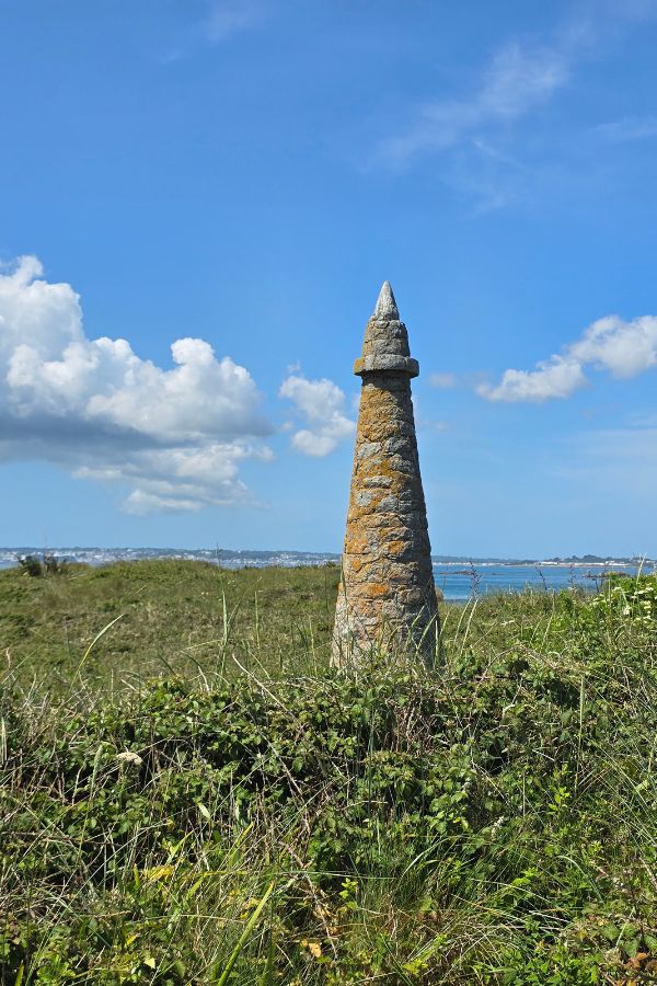 A tower in a field in the middle of Herm