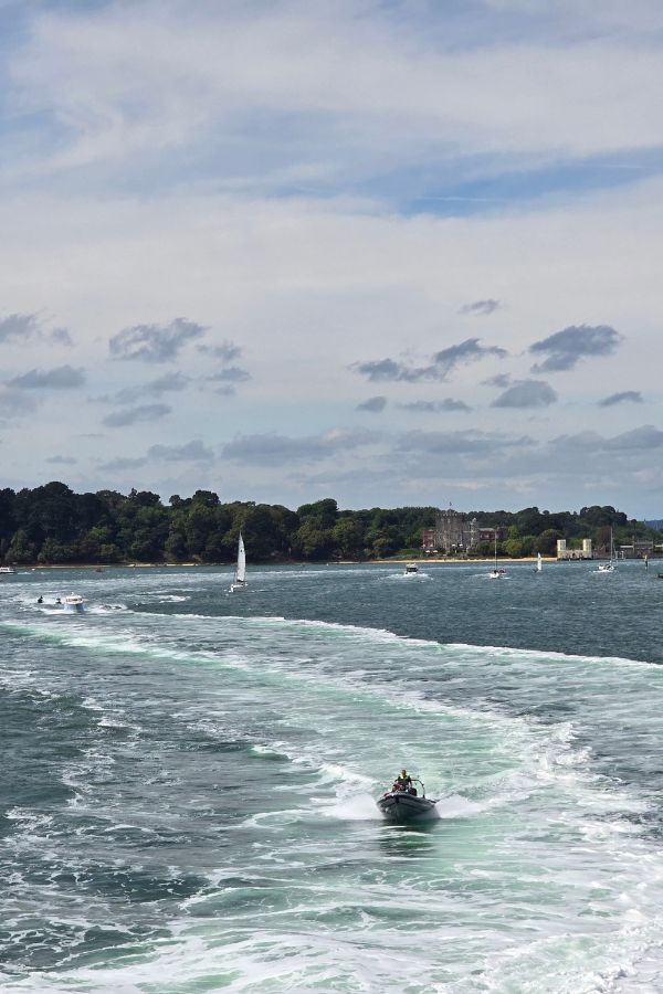 Pilot boat following the ferry
