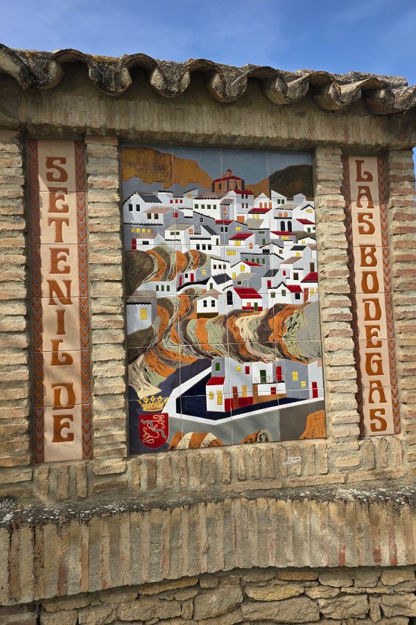 Town sign at the top of the hill
