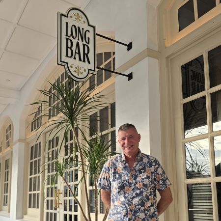 Ben outside the famous Long Bar at Raffles Hotel 